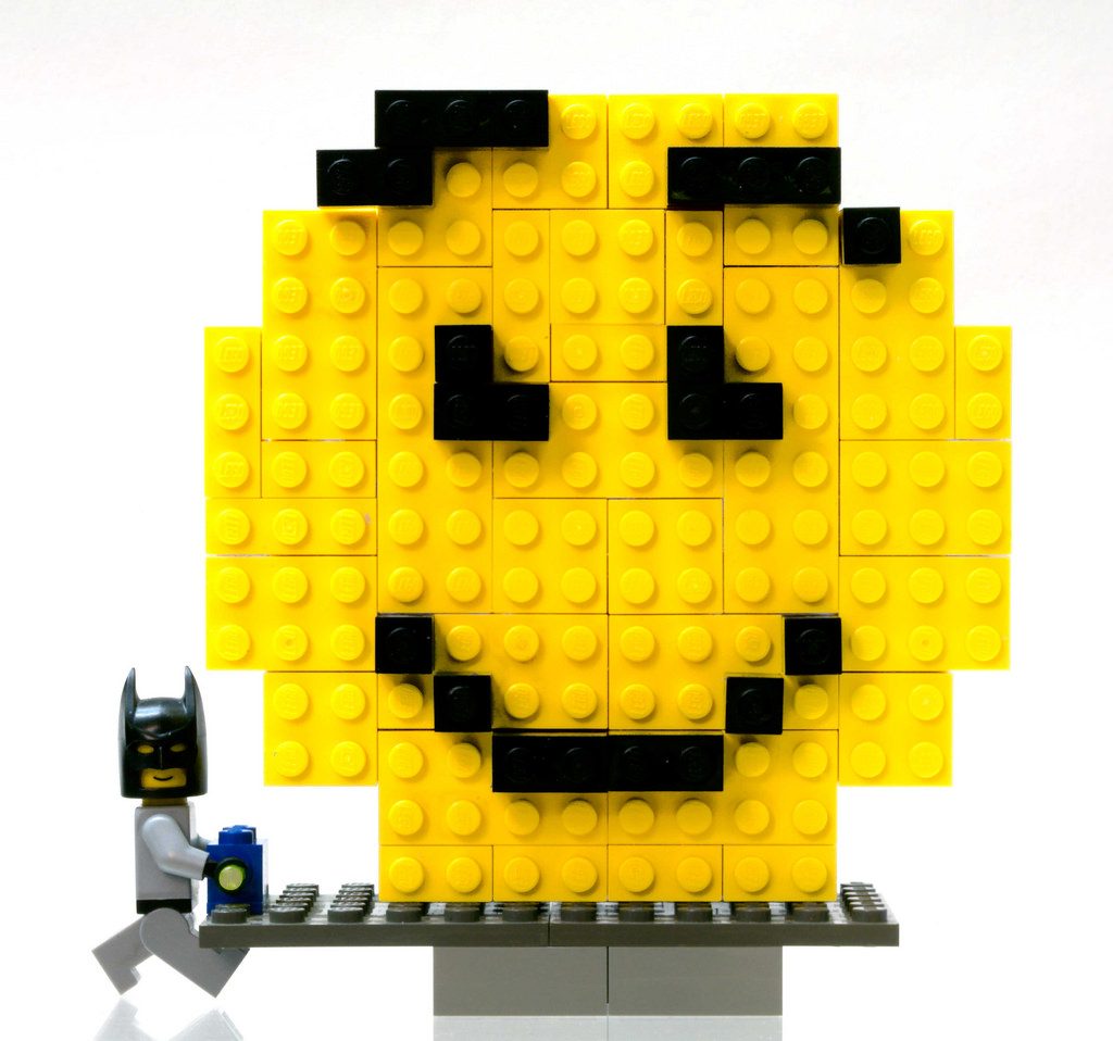Lego Batman and a large Lego Smiley Face